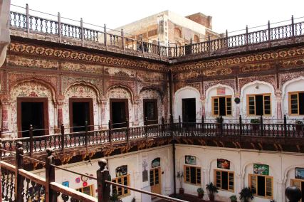 the courtyard in the center of the building with frescoes 